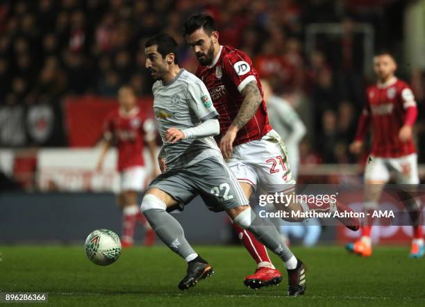 Henrikh Mkhitaryan of Manchester United competes with Marlon Pack of Bristol City during the Carabao Cup Quarter-Final match between Bristol City and...