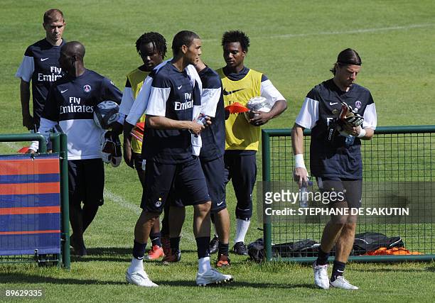 Paris-Saint-Germain's players, Christophe Jallet, Claude Makelele, Peguy Luyindula, Guillaume Hoarau, Stephane Sessegnon and Gregory Coupet arrive to...