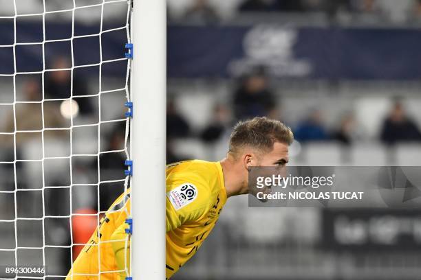 Montpellier's French goalkeeper Benjamin Lecomte reacts during the French L1 football match between Bordeaux and Montpellier on December 20, 2017 at...