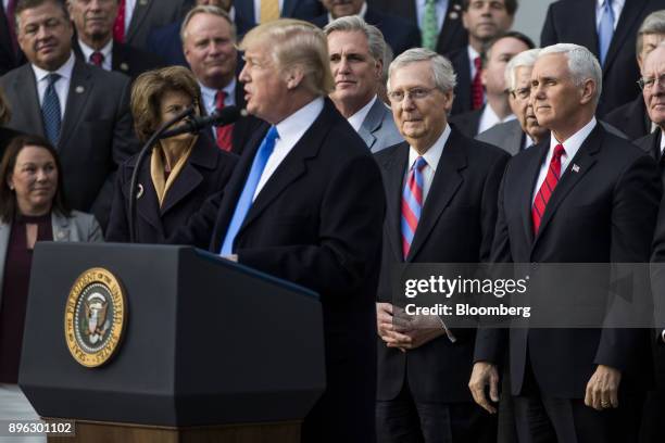 Senate Majority Leader Mitch McConnell, a Republican from Kentucky, second right, and U.S. Vice President Mike Pence, right, listen as U.S. President...