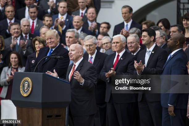 Representative Kevin Brady, a Republican from Texas and chairman of the House Ways and Means Committee, center, speaks during a tax bill passage...