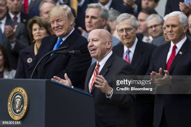 Representative Kevin Brady, a Republican from Texas and chairman of the House Ways and Means Committee, center, speaks during a tax bill passage...