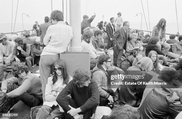 Pop fans travelling to the Isle of Wight Festival on the Isle of Wight ferry, circa 1970.