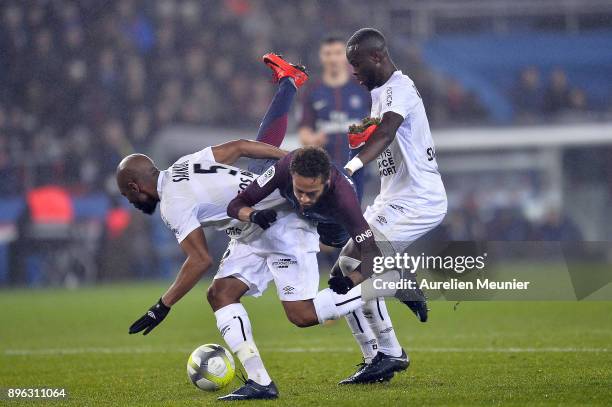 Neymar Jr of Paris Saint-Germain is tackled by Baissama Sankoh of SM Saen during the Ligue 1 match between Paris Saint Germain and SM Caen at Parc...