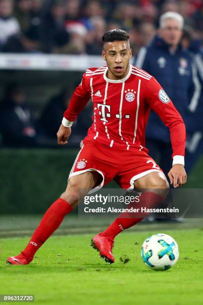 Corentin Tolisso of FC Bayern Muenchen runs with the ball during the DFB Cup match between Bayern Muenchen and Borussia Dortmund at Allianz Arena on...