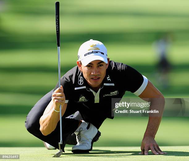 Camilo Villegas of Colombia lines up his putt on the 13th hole during the first round of the World Golf Championship Bridgestone Invitational on...