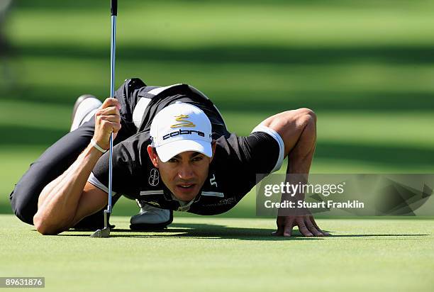 Camilo Villegas of Colombia lines up his putt on the 13th hole during the first round of the World Golf Championship Bridgestone Invitational on...