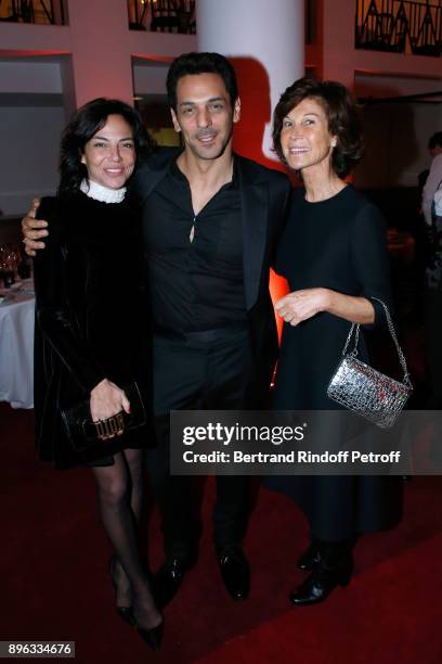 Actor Tomer Sisley standing between his wife Sandra and Sylvie Rousseau attend the Gala evening of the Pasteur-Weizmann Council in Tribute to Simone...