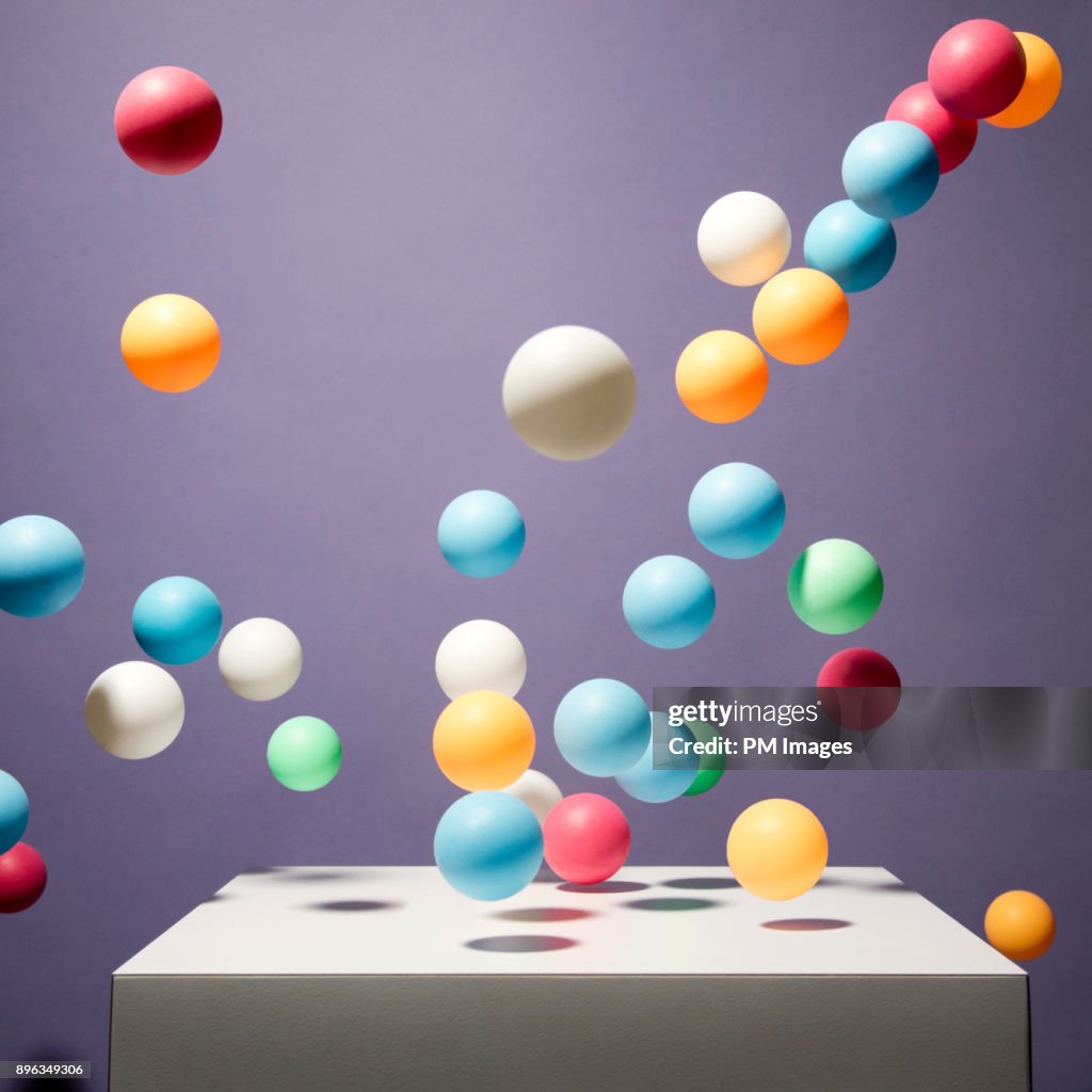 Color Bounce Balls Of Various Color Bouncing Off Of White Box High-Res Stock Photo ...