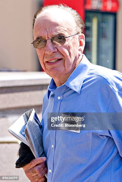 Rupert Murdoch, chairman and chief executive officer of News Corp., walks outside during the Allen & Co. Media and Technology Conference in Sun...