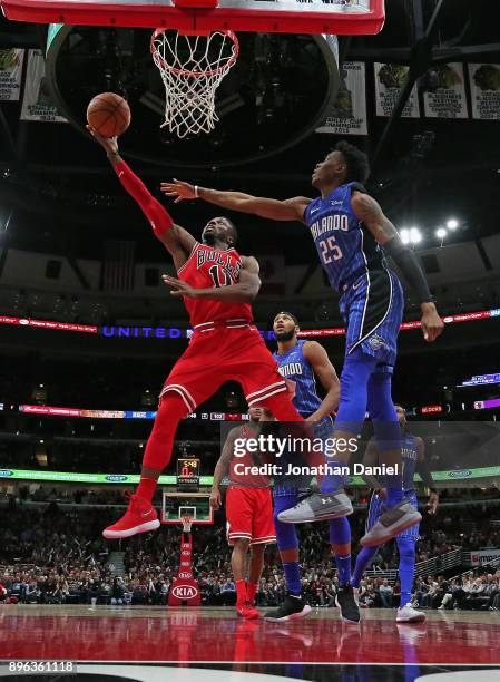 David Nwaba of the Chicago Bulls puts up a shot past Wesley Iwundu of the Orlando Magic at the United Center on December 20, 2017 in Chicago,...