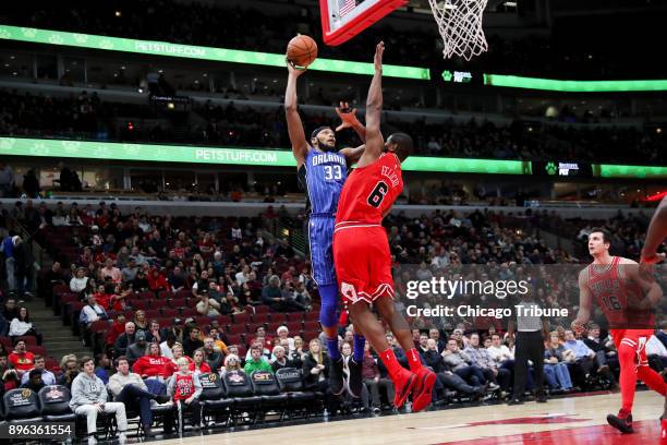 The Orlando Magic's Adreian Payne makes a shot over the Chicago Bulls' Cristiano Felicio during the second half at the United Center in Chicago on...