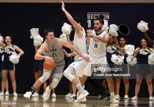 New Hampshire Wildcats forward Tanner Leissner tries to get past George Washington Colonials guard Yuta Watanabe and forward Arnaldo Toro during a...