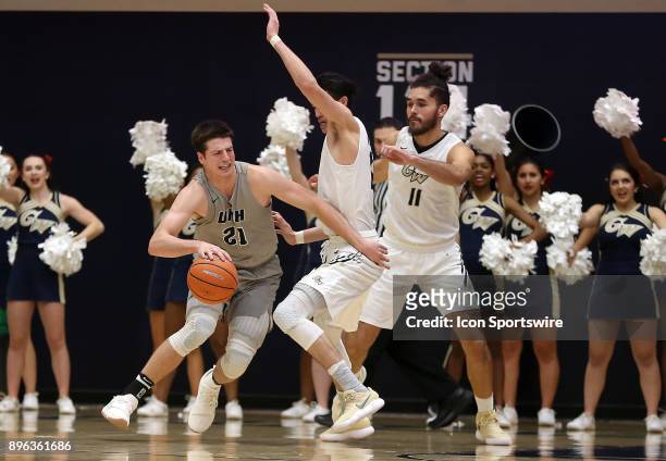 New Hampshire Wildcats forward Tanner Leissner tries to get past George Washington Colonials guard Yuta Watanabe and forward Arnaldo Toro during a...