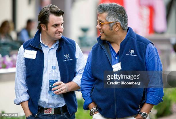 Quincy Smith, president of CBS Interactive at CBS Corp., left, talks with Henry "Hank" Vigil, vice president of consumer strategy at Microsoft Corp.,...