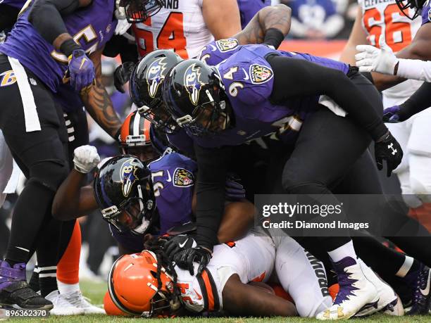 Running back Isaiah Crowell of the Cleveland Browns is tackled by defensive tackle Michael Pierce, linebacker Matthew Judon and defensive tackle Carl...