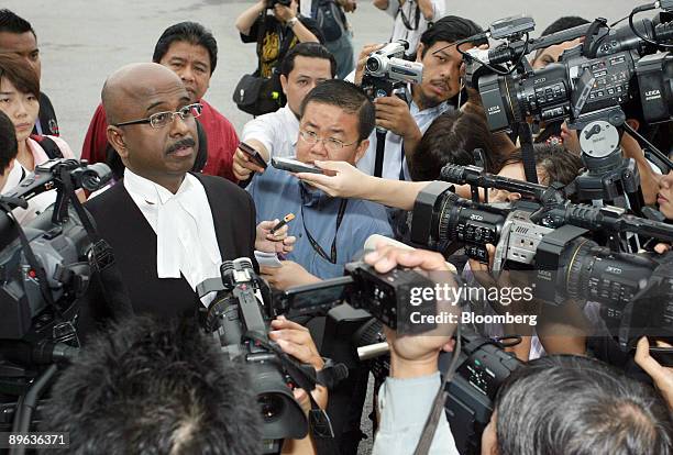 Sankara Nair, defense counsel for Anwar Ibrahim, Malaysia's opposition leader, speaks to the media as he arrives for Anwar's trial at the High Court...