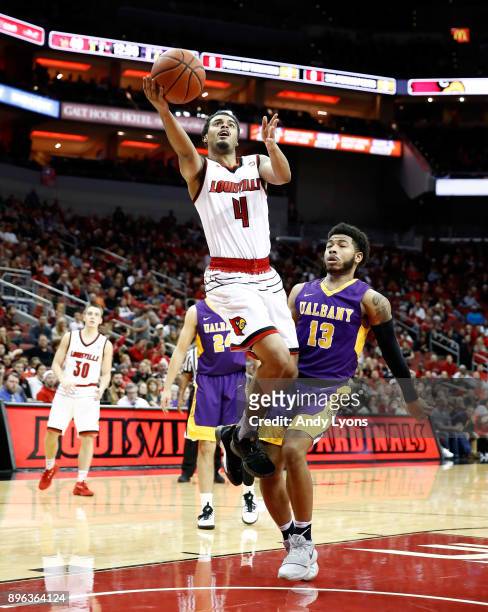 Quentin Snider of the Louisville Cardinals shoots the ball during the game against the Albany Great Danes at KFC YUM! Center on December 20, 2017 in...