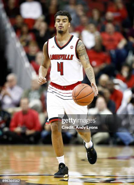 Quentin Snider of the Louisville Cardinals dribbles the ball during the game against the Albany Great Danes at KFC YUM! Center on December 20, 2017...