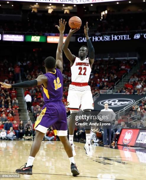 Deng Adel of the Louisville Cardinals shoots the ball during the game against the Albany Great Danes at KFC YUM! Center on December 20, 2017 in...