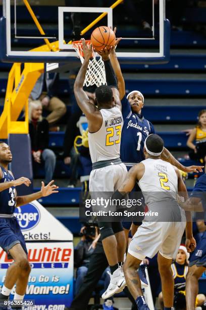 Jackson State Tigers guard Charles Taylor Jr. Tries to block a shot by Toledo Rockets forward Willie Jackson during a regular season non-conference...