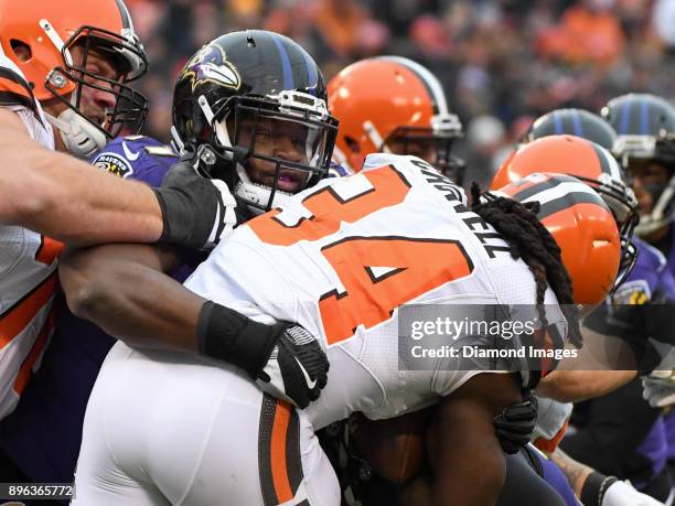 Defensive tackle Michael Pierce of the Baltimore Ravens tackles running back Isaiah Crowell of the Cleveland Browns in the first quarter of a game on...