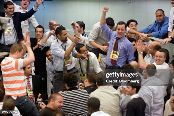 Traders celebrate the last minutes of derivatives pit trading, at the Brazilian Bolsa de Mercadorias e Futuros, or Brazilian Mercantile and Futures...