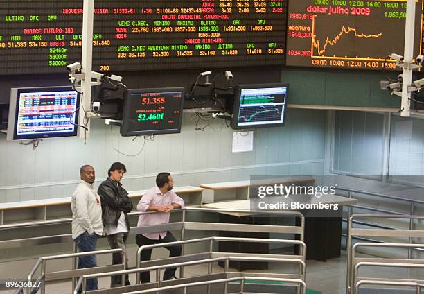 Traders work on an almost empty floor at the Brazilian Bolsa de Mercadorias e Futuros, or Brazilian Mercantile and Futures Exchange , in Sao Paulo,...