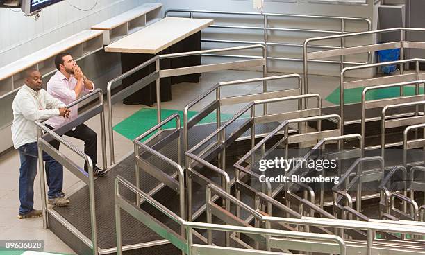 Traders work on an almost empty floor at the Brazilian Bolsa de Mercadorias e Futuros, or Brazilian Mercantile and Futures Exchange , in Sao Paulo,...