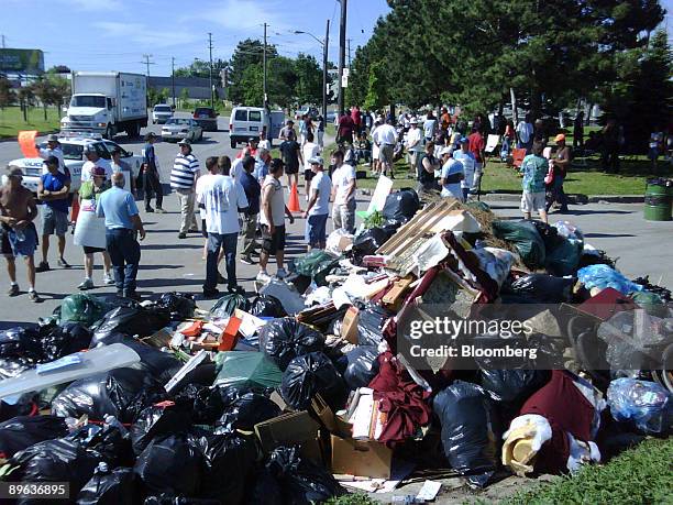 Illegally dumped garbage spills onto entranceway of the Bermondsey Road waste transfer station in Toronto, Ontario, Canada, on Tuesday, June 23,...