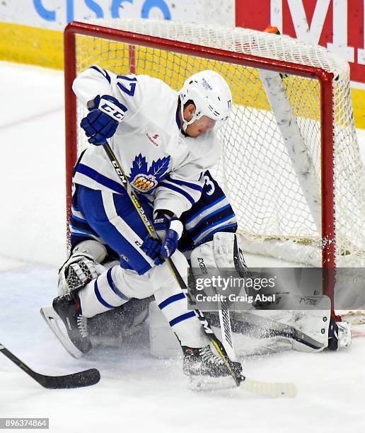 Richard Clune of the Toronto Marlies is stopped by Michael Hutchinson of the Manitoba Moose during AHL game action on December 17, 2017 at Ricoh...