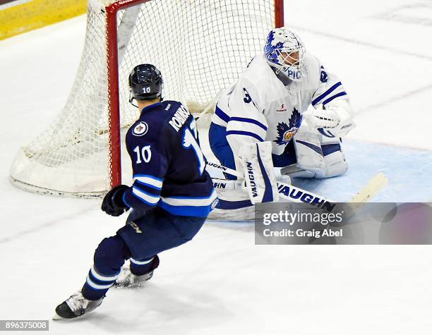 Calvin Pickard of the Toronto Marlies stops a shot by Buddy Robinson of the Manitoba Moose during AHL game action on December 17, 2017 at Ricoh...