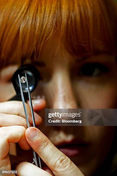 Beth Leinonen, a gemologist, examines a diamond for imperfections at a store run by Brilliant Earth, which uses conflict-free diamonds from Canadian...