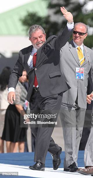 Luiz Inacio Lula da Silva, Brazil's president, center, arrives for the Food Security session at the G8 summit in L'Aquila, Italy, on Friday, July 10,...