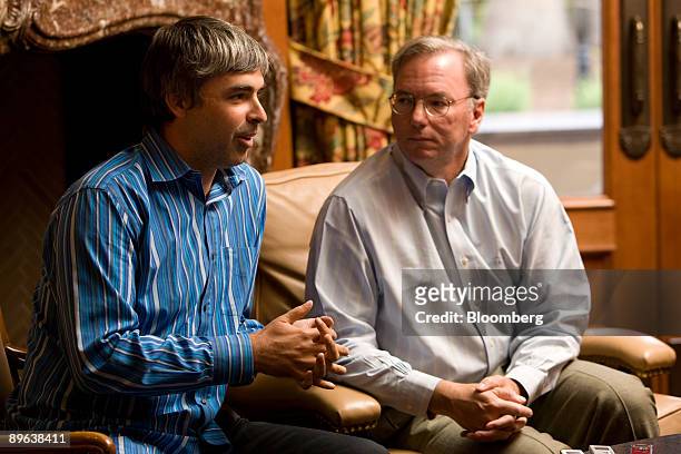 Larry Page, Google Inc.'s co-founder and products president, left, and Eric Schmidt, chairman and chief executive officer of Google Inc., speak with...