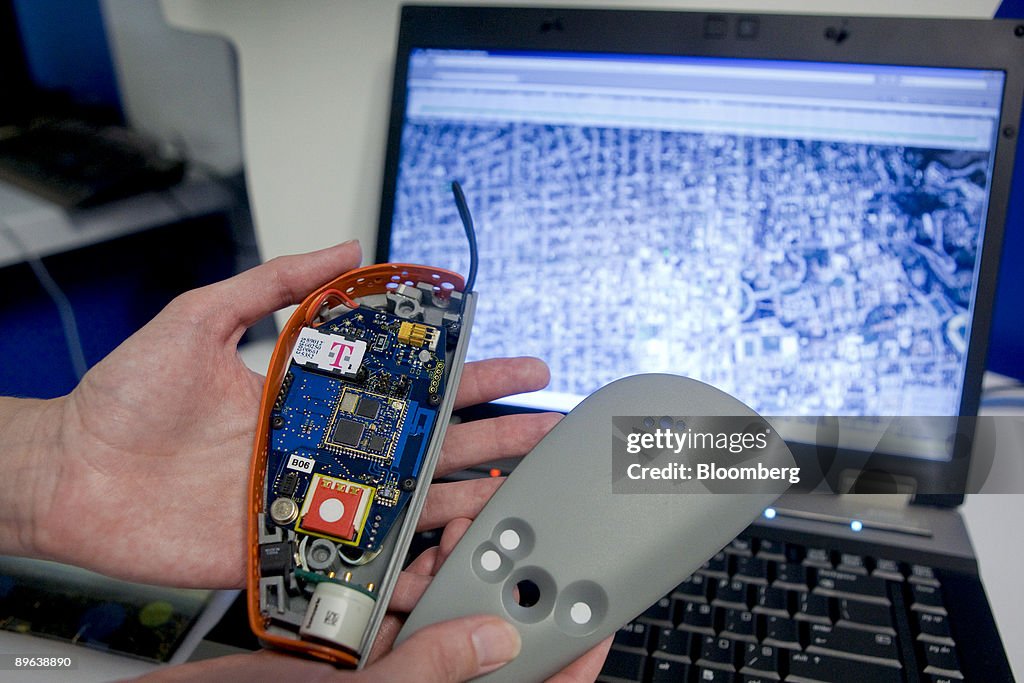An Intel researcher displays the components of a handheld po