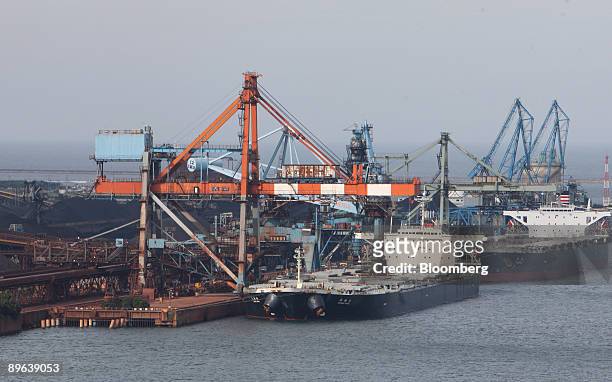 Dry-bulk ships are moored at a steel plant in Kamisu city, Ibaraki prefecture, Japan, on Tuesday, July 7, 2009. Prime Minister Taro Aso pledged on...