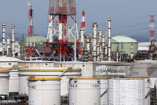 Oil tanks stand at an oil refinery in Kamisu city, Ibaraki prefecture, Japan, on Tuesday, July 7, 2009. Prime Minister Taro Aso pledged on June 10 to...