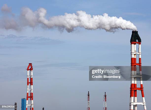Smoke billows out of the chimney at a plant in Kamisu City, Ibaraki Prefecture, Japan, on Tuesday, July 7, 2009. Prime Minister Taro Aso pledged on...
