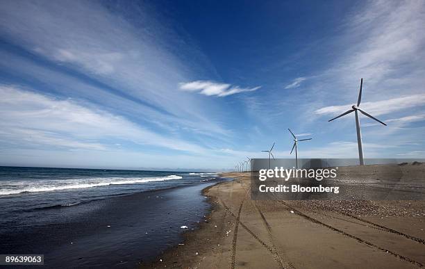 Wind turbines stand at the Hasaki Wind Farm in Kamisu City, Ibaraki Prefecture, Japan, on Tuesday, July 7, 2009. Prime Minister Taro Aso pledged on...