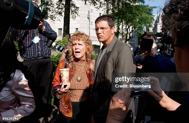 Dominic and Ronnie Sue Ambrosino, victims of Bernard Madoff, founder of Bernard L. Madoff Investment Securities LLC, speak to the media outside...