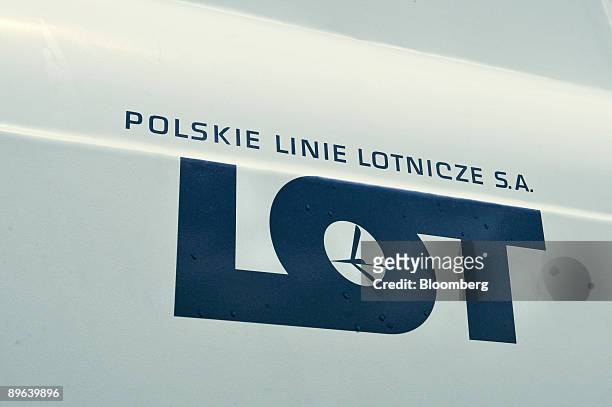 The company logo for Poland's national air carrier Polskie Linie Lotnicze LOT SA, sits on the side of a fuel tanker at the John Paul II International...