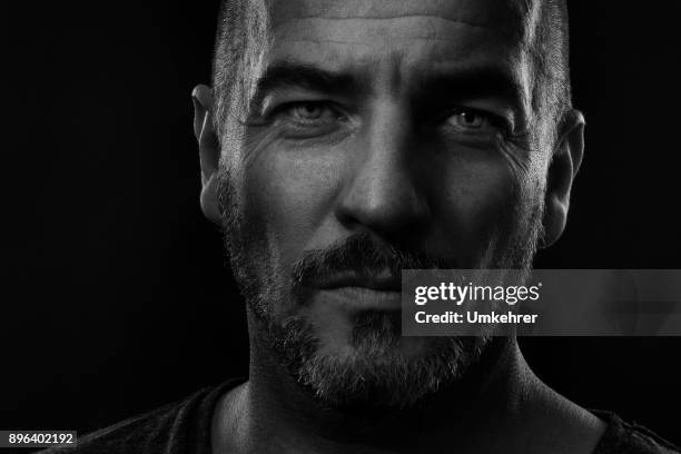 straight looking man black and white close up - passion stock pictures, royalty-free photos & images