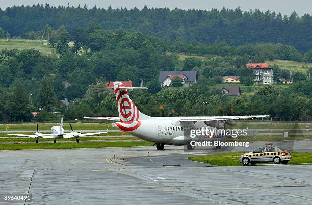 An aircraft from EuroLot, a subsidiary of Poland's national air carrier Polskie Linie Lotnicze LOT SA, taxi's on the runway at the John Paul II...