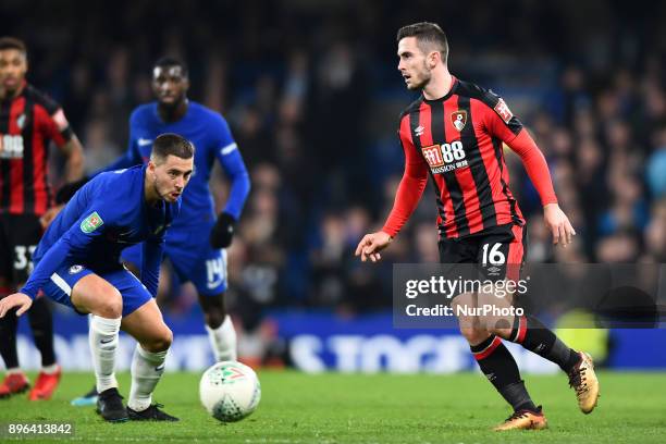Chelsea Midfielder Eden Hazard eyes the ball with Bournemouth's Lewis Cook during the Carabao Cup Quarter - Final match between Chelsea and AFC...