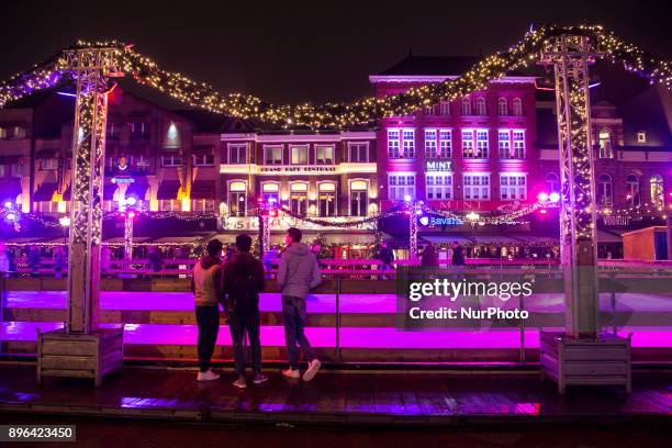 Evening and night images of Eindhoven city with Christmas light decoration all over the city center. Various Christmas trees are decorated, almost...