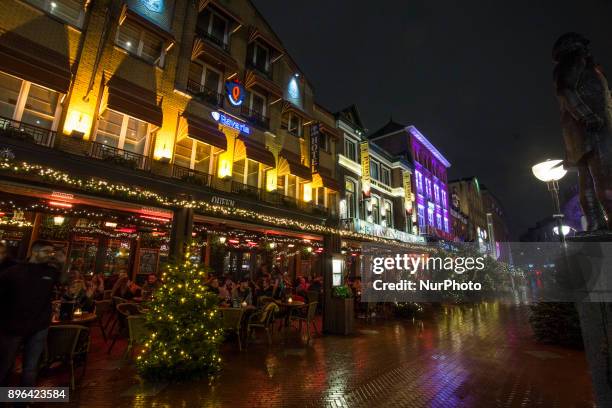 Evening and night images of Eindhoven city with Christmas light decoration all over the city center. Various Christmas trees are decorated, almost...