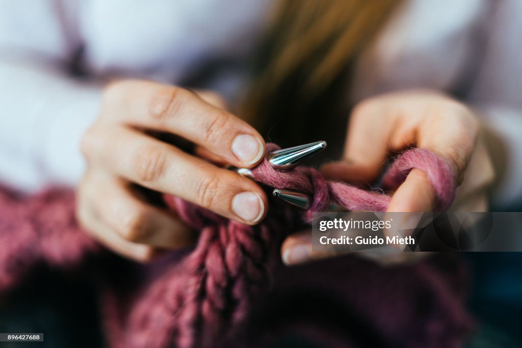 Woman knitting.