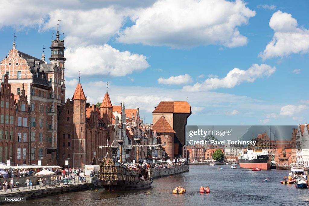 Moltawa River flowing through Gdansk's Old Town with old ship crane 'Zuraw', Poland