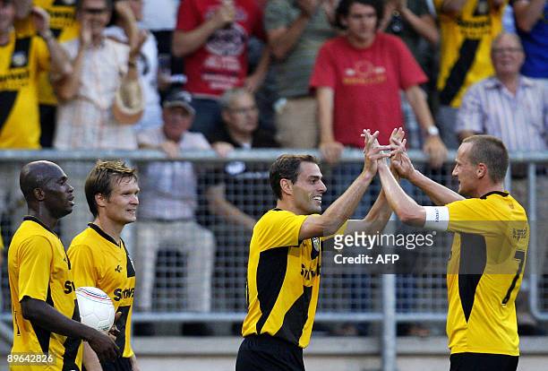 Breda's forward Anthony Lurling celebrates with his teammate midfielder Edwin de Graaf after scoring his team second goal during the 3rd round...